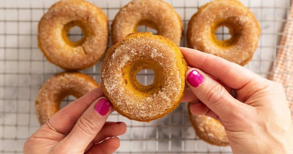 Coating Pumpkin Donuts in Cinnamon-Sugar