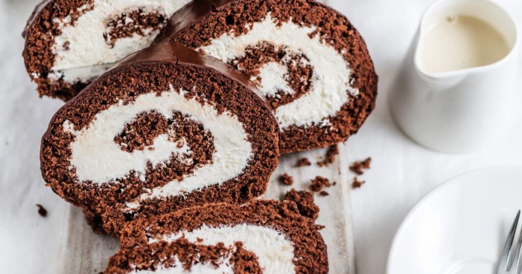 Slicing Chocolate Swiss Cake Roll