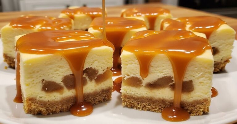 Caramel apple cheesecake bars sliced into squares on a plate, caramel drizzle on top